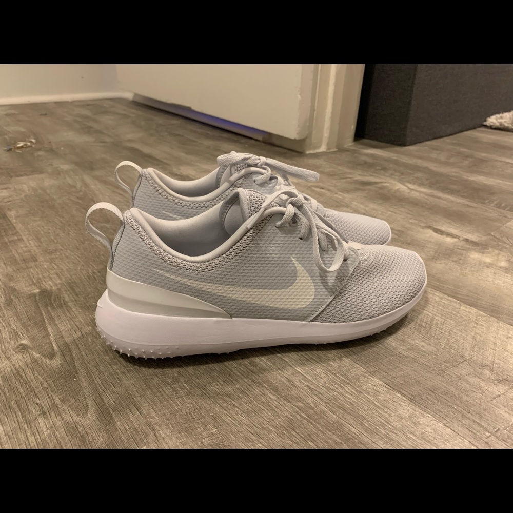 Grey Nike tennis shoes.